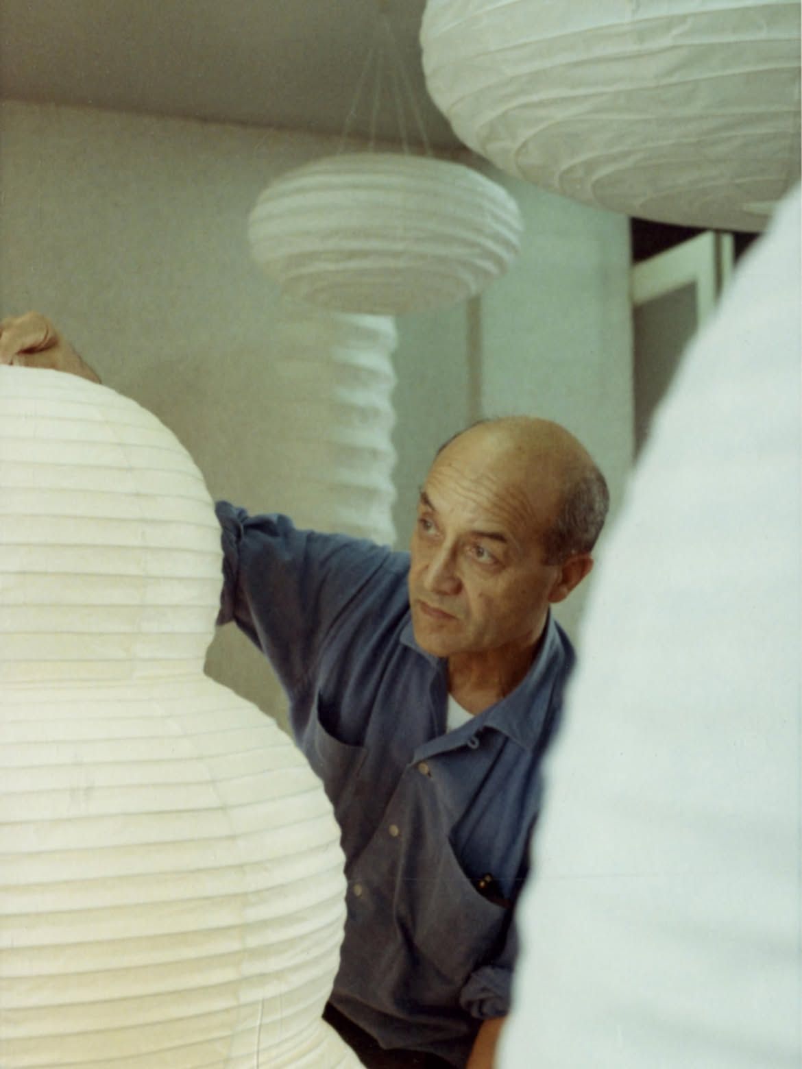 Isamu Noguchi with Akari light sculptures in Japan, 1968. The Noguchi Museum Archives, 03620. ©INFGM / ARS