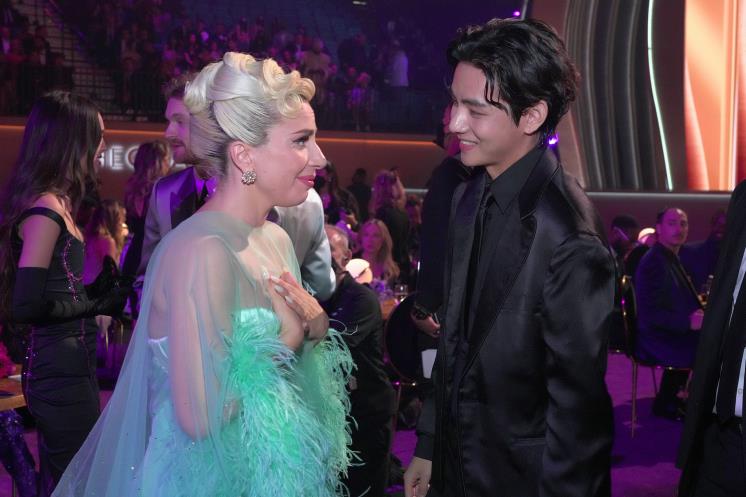 LADY GAGA and V of BTS . Photo by Kevin Mazur/Getty Images for The Recording Academy