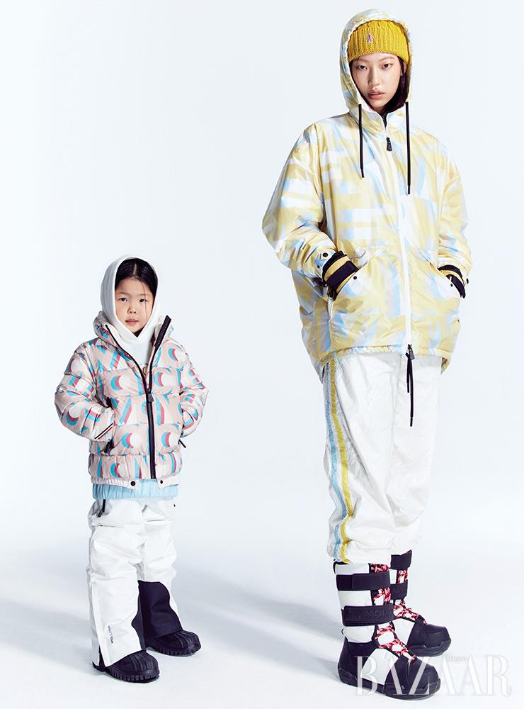 (왼쪽부터) 진이 입은 패딩, 후디, 팬츠, 부츠는 모두 Moncler Grenoble Enfant. 희정이 입은 아노락, 팬츠, 비니, 장갑은 모두 Moncler Grenoble. 부츠는 3 Moncler Grenoble.