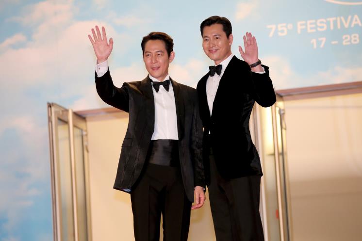 CANNES, FRANCE - MAY 19: Lee Jung-jae and Jung Woo-sung attend the screening of ″Hunt″ during the 75th annual Cannes film festival at Palais des Festivals on May 19, 2022 in Cannes, France. (Photo by Gisela Schober/Getty Images)